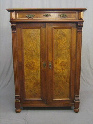 A 19th Century walnut cabinet, the top fitted a drawer with cupboard underneath