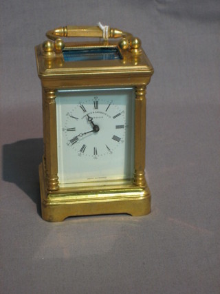 A  20th  Century  reproduction  miniature  time  clock,  the   dial marked Lawrence & Lawrence Ltd London