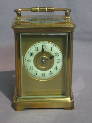 A   19th   Century  French  8  day  striking  mantel   clock   with enamelled dial and Arabic numerals contained in a gilt metal case