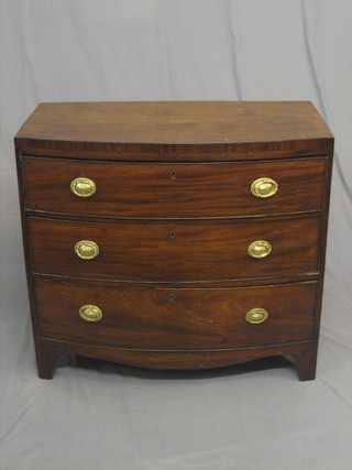 A Georgian mahogany bow front chest of 3 long drawers,  raised on  bracket feet with brass escutcheons and  replacement  handles  36"