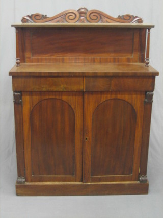 A William IV mahogany chiffonier with raised shelved back,  the base fitted 2 drawers above arched shaped panelled doors,  raised on a platform base 36"