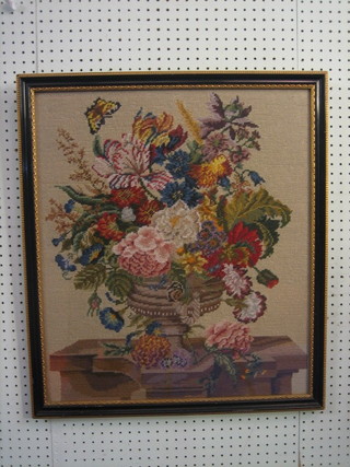 A  Berlin  wool  work  panel  of  a  vase  of  flowers  24"  x  20" contained in a Hogarth frame