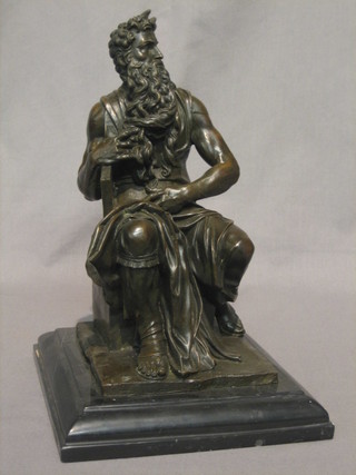 A  20th  Century bronze figure of a seated "Moses", raised  on  a marble base 13"