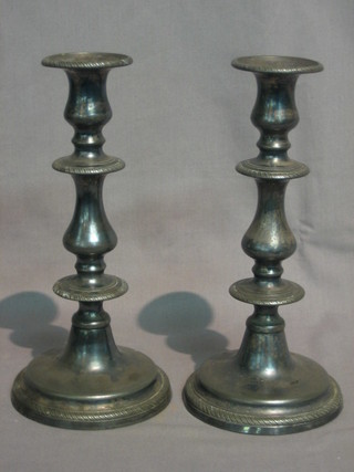 A pair of 19th Century metal candlesticks with ejectors 9"
