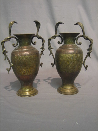 A  pair  of Benares brass twin handled vases with  cobra  handles 12"