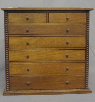 A  19th/20th Century pine collector's cabinet fitted 2 short and  5 long drawers 13"