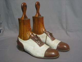 A  pair  of gentleman's 1920's brown  and  white  Correspondent shoes complete with trees 11"