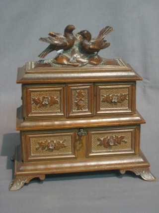 A  19th  Century  carved French  wooden  jewellery  casket  with hinged  lid,  the lid surmounted by 2 figures of  birds,  raised  on bracket feet 9" (slight chip to birds wings)