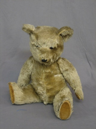 A large brown teddybear with articulated limbs 12"