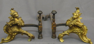 A  pair  of 19th Century French gilt Ormolu fire  dogs  decorated cherubs