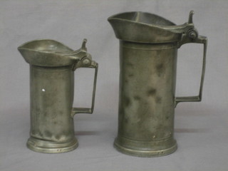 2  18th/19th  Century Continental lidded pewter jugs  8"  and  6"