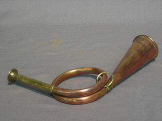 A small reproduction copper and brass hunting horn