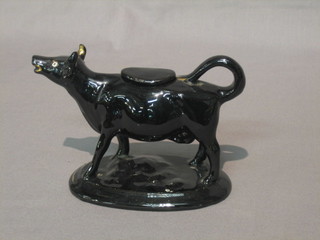 A 19th Century black glazed cow creamer 5"