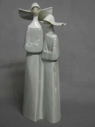 A Lladro figure of 2 standing nuns, base incised 6, 12"