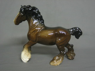 A  Beswick  figure of a standing bay shire horse with  right  hoof crooked, 8"