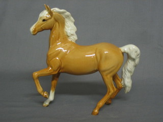A  Beswick figure of a Palomino horse with left hoof crooked  7"