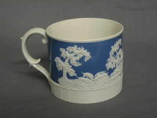 A  19th Century blue and white porcelain mug decorated  hunting scenes (base with slight chip)