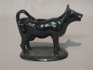A 19th Century black glazed pottery cow creamer 5"