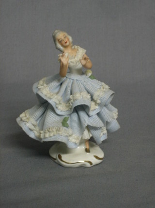 A porcelain figure of a Crinoline lady 4"