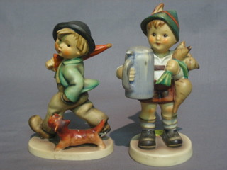A  Hummel  figure of a standing boy with  beerstein  and  turnips (head  f and r) 6" and 1 other walking boy with dog 5" (f  and  r)