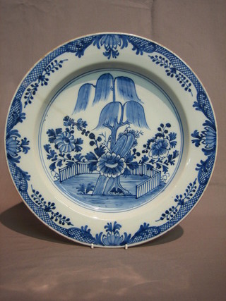 An  18th  Century Oriental blue and white bowl decorated  a  tree 13"