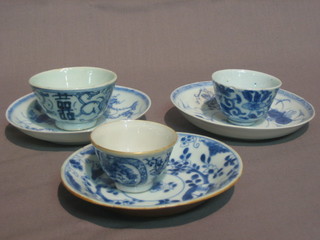 3  various  19th  Century Oriental blue and white  tea  bowls  and saucers