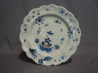 An  18th/19th  Century  Delft pottery plate  with  ribbed  border, decorated leaves and insects 10"