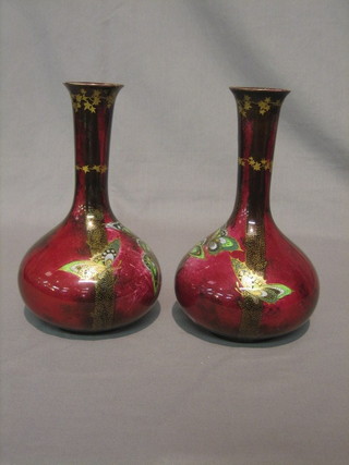A  pair  of  Devon  Sylvan  Lustrine  Fieldings  red  glazed  club shaped vases decorated butterflies 9 1/2"