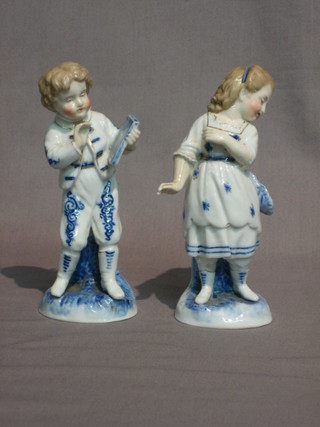 A  pair  of 19th Century Continental porcelain  figures  boy  with slate and standing girl, bases with anchor mark 5"