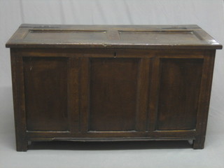 An 18th Century oak coffer of panelled construction with  hinged lid 46"