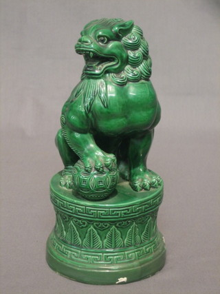 A 19th/20th Century green glazed Oriental figure of a seated Dog of Fo 8" (chips to base)