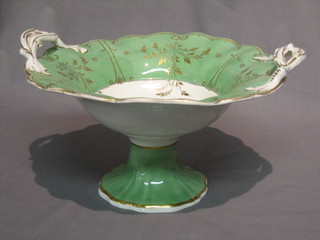 A 19th Century porcelain twin handled fruit bowl with green  and gilt banding, the centre decorated rural scenes 12"