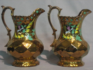 A  pair  of  19th Century lustre jugs  with  vinery  decoration  7"