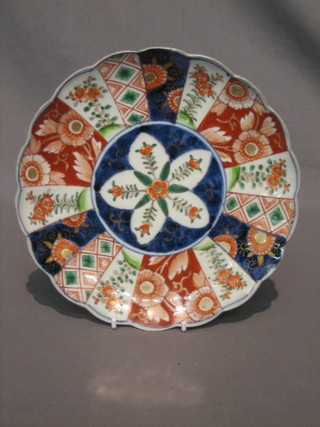 A  19th  Century  Japanese Imari plate with  lobed  and  panelled decoration 8 1/2" (crack to base)