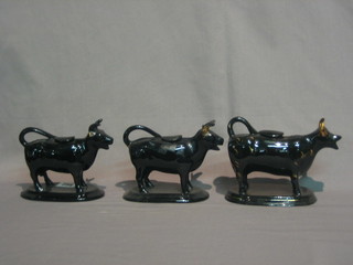 3 19th Century black glazed pottery cow creamers (all f)