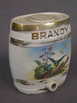 A  19th Century oval pottery brandy barrel, decorated a bird  and with gilt metal banding (some rubbing) 14"