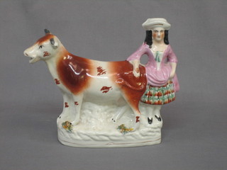 A 19th Century Staffordshire cow creamer 9" (f and r)