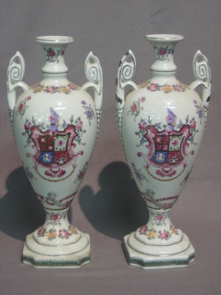 A  pair  of 19th Century style twin handled porcelain  vases  with armorial decoration 12"