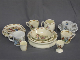 A  circular  Royal  Doulton  Bunnykins bowl 8",  1  other  6",  a cereal bowl 6", 2 egg cups, 3 7" tea plates, 3 cups and 3  saucers together  with  a Wedgwood Bunnykins cereal bowl, 2  mugs,  an egg  cup,  a silver plated tea service and etc and  1  vol.  "British  Biscuit Tins"