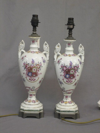 A  pair  of  Oriental style crackle glazed  twin  handled  porcelain table lamps with armorial decoration 14"