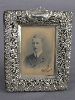 An embossed silver easel photograph frame 9" x 7", Birmingham 1903