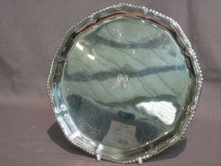 A Georgian style silver salver with bracketed border, raised on 4 hoof feet, London 1931 purchased at Harrods, 11 ozs