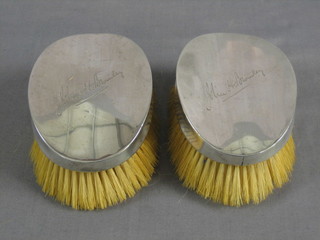 A pair of military silver backed hair brushes, Sheffield 1910 by Walker & Hall