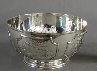 A modern circular embossed limited edition silver bowl decorated various animals, the base marked Tessiers London 1/2000, with Silver Jubilee hallmark, 40 ozs