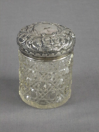 A Victorian circular hob nail cut dressing table jar with embossed silver lid Chester 1899