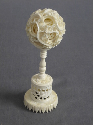 A carved ivory puzzle ball, 1 2/2"