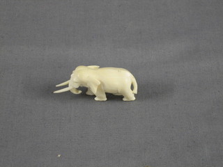 A small carved ivory figure of an elephant 2"