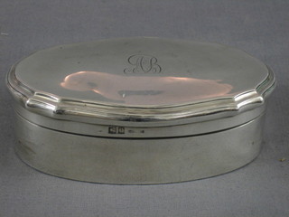 An oval silver dressing table jar with hinged lid, Birmingham 1912 5", 6 ozs