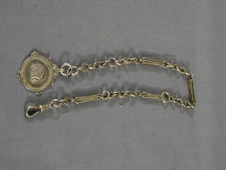 A silver watch chain hung a silver watch medallion 15 1/2"