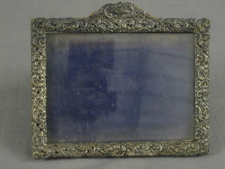 A rectangular embossed silver easel photograph frame Birmingham 1924 6" x 5"